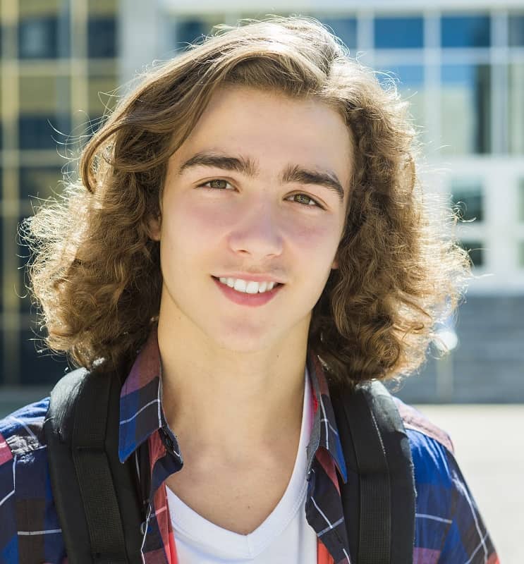 teen boy with long hair