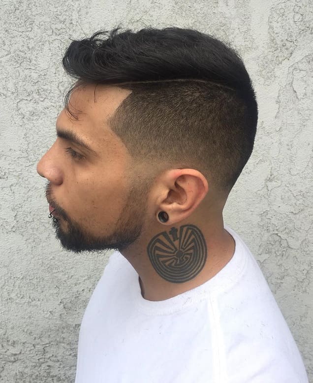 comb over blowout hairstyle with low fade