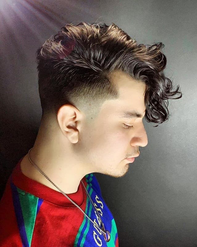 curly hairstyle with low fade