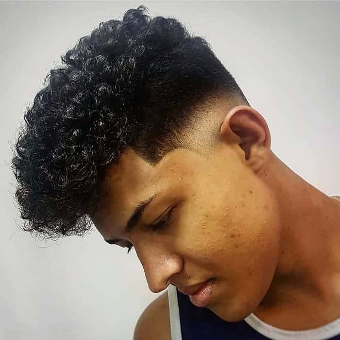 curly hair with low skin fade