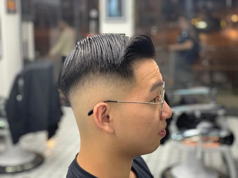 Asian guy with mid bald fade hairstyle