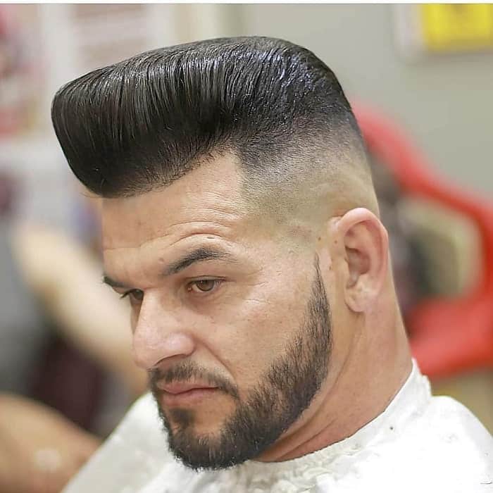 middle aged man with pompadour