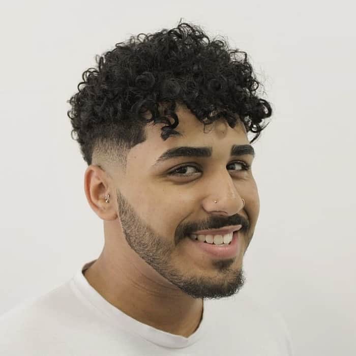 curly taper fade for oval faced men
