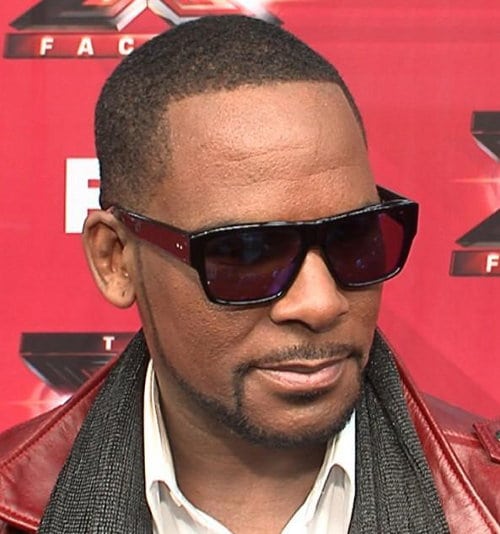 R. Kelly buzz haircut with rap industry standard beard.