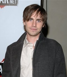 Photo of Rider Strong with layered bangs hair.