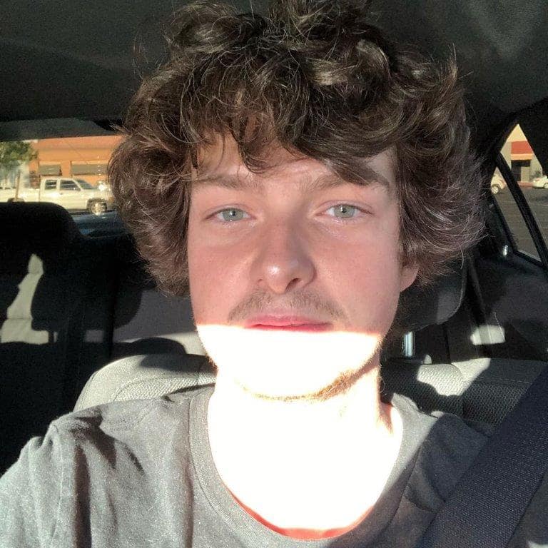 young boy with shaggy haircut