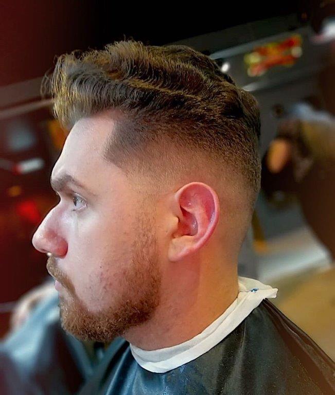 wavy short pompadour with mid fade