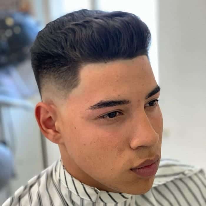 wavy slick back hair with low fade
