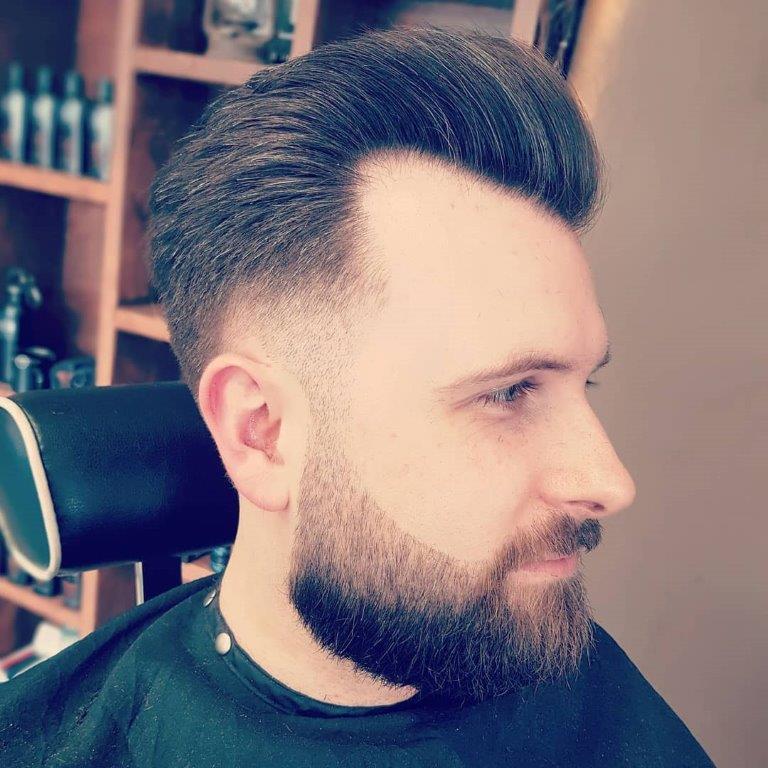 guy with taper fade and beard