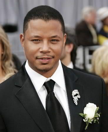 Photo of Terrence Howard short hair with thin mustache and beard.