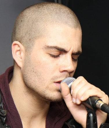 Image of Max George shaved head.