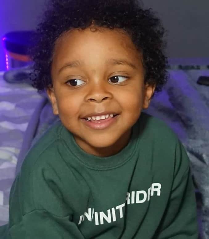 toddler boy with short curly hair