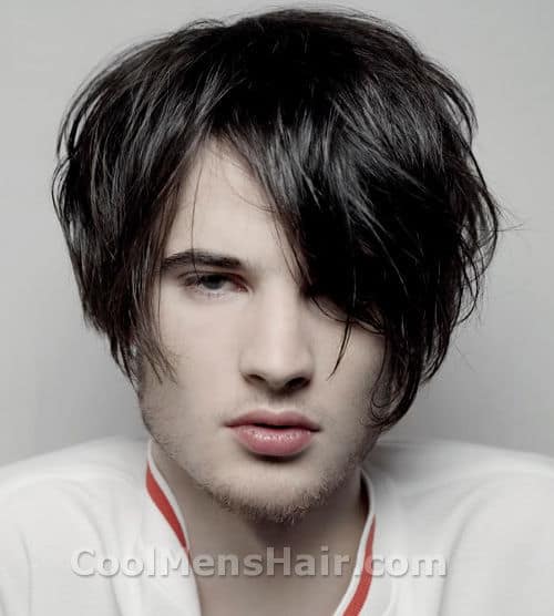 Photo of Tom Sturridge hair with bangs covered one eye.