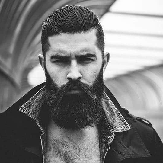 slicked back undercut with thick beard