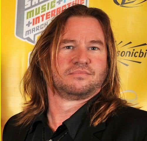 Photo of Val Kilmer long hairstyle.