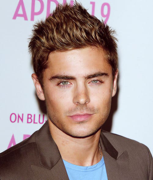 Photo of Zac Efron short spiky hair.