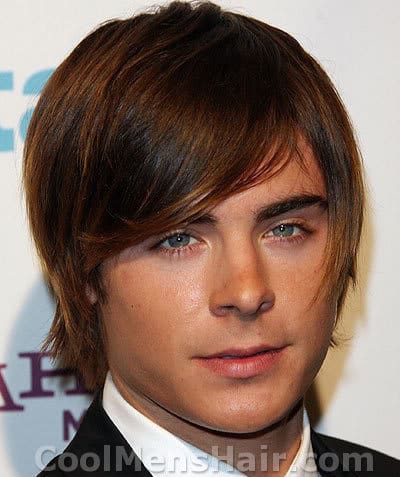 Image of Zac Efron straight shaggy hairdo.