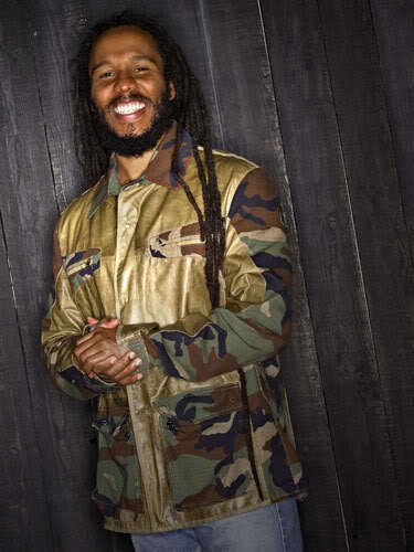 Photo of Ziggy Marley long dreadlock hair. 